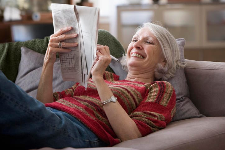 elderly lady playing crosswords